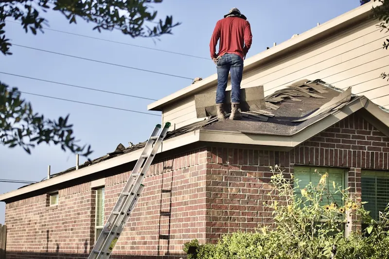 Professional roofer working on a residential roof in Marina Peninsula